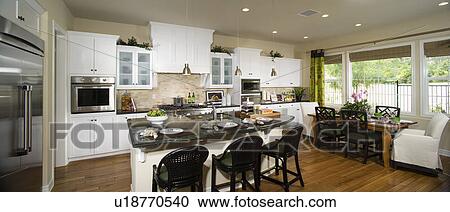 Interior of a contemporary dining room and kitchen View Large Photo Image Stock Image - Interior of a contemporary dining room and kitchen. Fotosearch