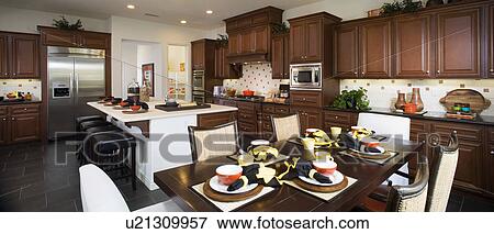 Stock Photo - Interior of a contemporary dining room and kitchen. Fotosearch
