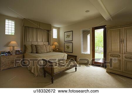 Stock Image - Interior of traditional bedroom. Fotosearch