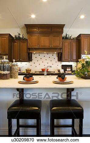 Stock Image - Kitchen with two barstools. Fotosearch