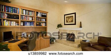Traditional Home Office With Built In Wood Shelving Fireplace