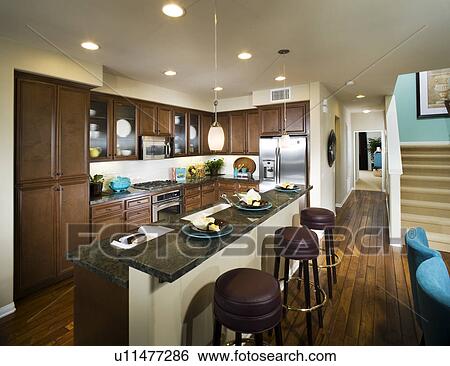 Stock Photograph - Interior of contemporary kitchen with bar. Fotosearch
