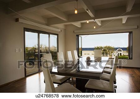 Stock Photo - Modern Dining Room with Reflective Table. Fotosearch