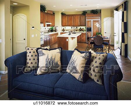 Stock Image - Traditional Kitchen and Blue Living Room Sofa. Fotosearch