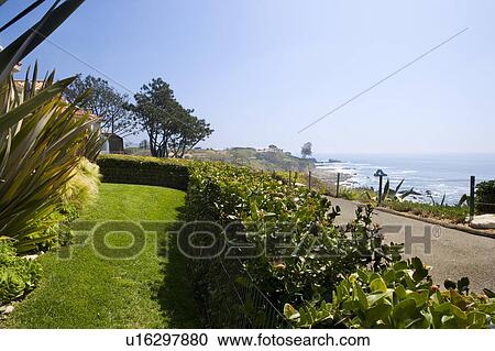 Stock Image - Landscaped Front Yard with Ocean View. Fotosearch