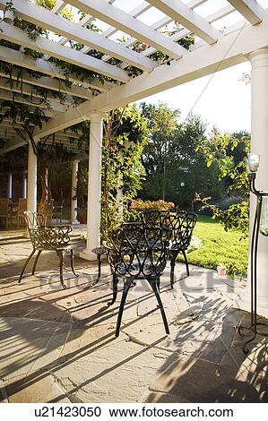 Outdoor Patio With Wrought Iron Dining Set Stock Image U21423050 Fotosearch - Patio Furniture Wrought Iron Dining Sets Outdoor Patio With Wrought Iron Dining Set Stock Image U21423050 Fotosearch - Patio Furniture Wrought Iron Dining Sets