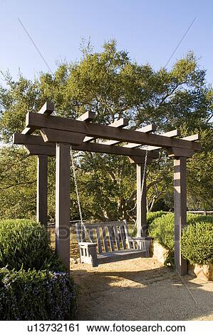 Stock Image - Swing Hanging from Arbor. Fotosearch