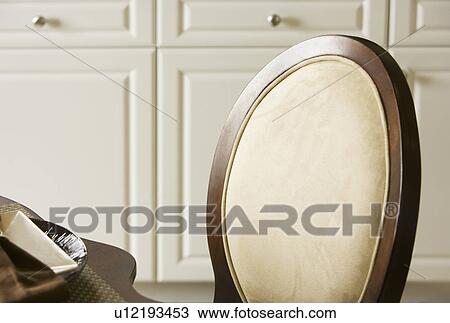 Stock Image - Back of suede dining chair. Fotosearch