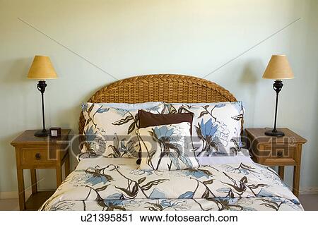 Stock Image - Bed with Wicker Headboard. Fotosearch
