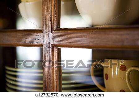 Cabinet with dishes bowls and mugs View Large Photo Image Stock Image - Cabinet with dishes bowls and mugs. Fotosearch