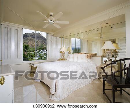 Stock Image - Cozy Bedroom with Diamond Head View. Fotosearch