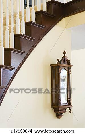 Picture - Detail of Bannister and Old Clock. Fotosearch