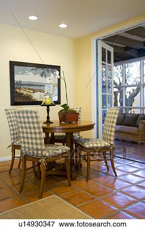 Stock Photo - Dining Table and Terra Cotta Floors. Fotosearch