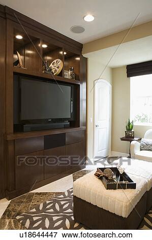 Stock Photo - Living Room with Large Entertainment Center. Fotosearch