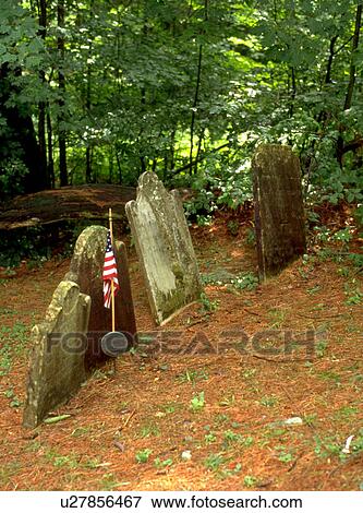 Stock Photo - Ancient graveyard with American flag. Fotosearch