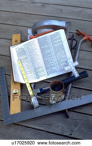 Carpenters tools Bible cross mug level tape measurer hammer and saw. St