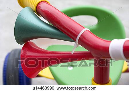 Close up of air horns on a multicolored plastic tricycle. Zawady Central Poland View Large Photo Image Stock Photograph - Close up of air horns on a multicolored plastic tricycle. Zawady Central Poland. Fotosearch