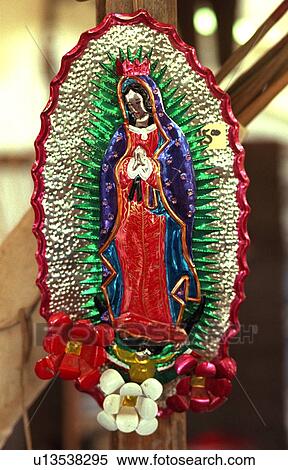 Stock Photography - Colorful metal art piece of Black Madonna at flea market. Battle Lake Minnesota USA. Fotosearch