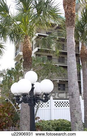 Stock Image - Condominiums and palm trees lining Florida Gulf. Fotosearch