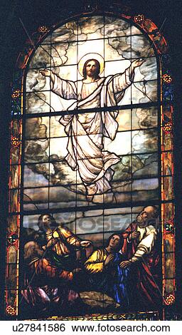 Stock Photograph - Jesus ascending to heaven on stained glass. Fotosearch