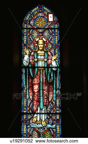 Stock Image - Jesus blessing on stained glass window. Fotosearch