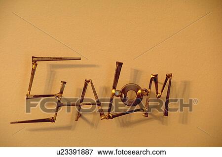 Stock Photo - Shalom sculpture designed with metal pieces. Fotosearch