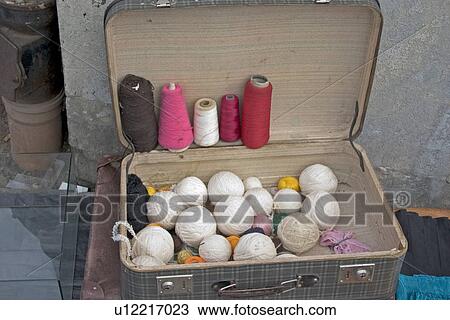 Stock Image - Spindles and spools of yarn at the Balucki Rynek Market. Lodz Central Poland. Fotosearch
