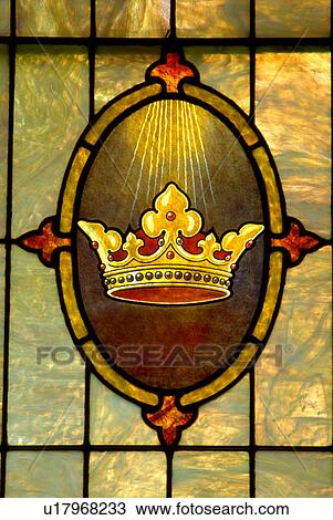 Stock Image - Stained glass window of crown Holy Communion Lutheran Church. Fotosearch