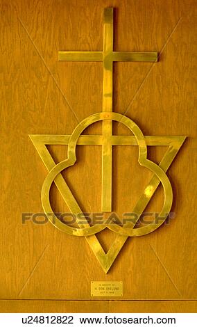 Trinity and Cross metal sculpture on wall View Large Photo Image Stock Image - Trinity and Cross metal sculpture on wall. Fotosearch
