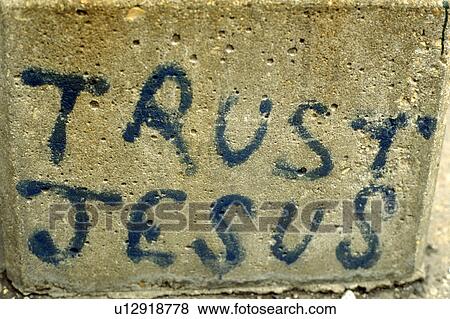 Wall with Trust Jesus spray painted on it View Large Photo Image Stock Photo - Wall with Trust Jesus spray painted on it. Fotosearch