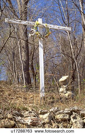 Stock Image - Wooden cross with flowered crown of thorns on top of a hill. West St Paul Minnesota USA. Fotosearch