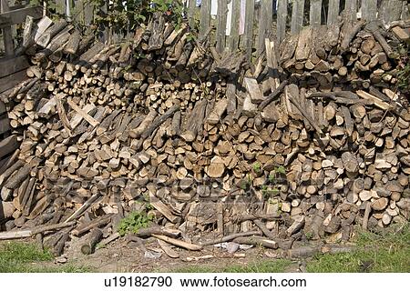 Stock Image - Woodpile on Polish farm. Zawady Central Poland. Fotosearch