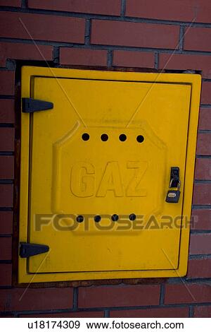 Yellow door covering a gas connection in Europe View Large Photo Image Stock Photo - Yellow door covering a gas connection in Europe. Fotosearch