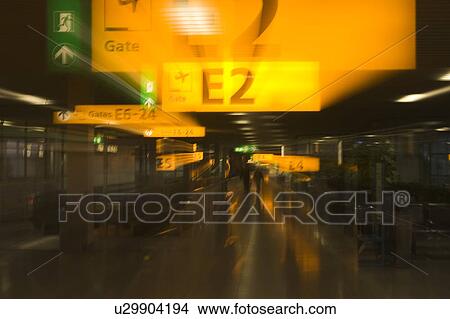 Arrow Sign, Entrance, Directional Sign, Defocused, Airport View Large Photo Image Picture - Arrow Sign, Entrance, Directional Sign, Defocused, Airport. Fotosearch