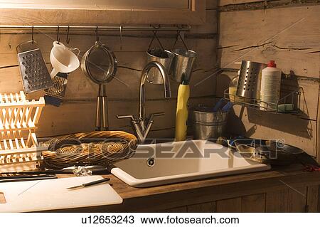 Stock Image - Basin, Basket, Cutlery, Cutter board, Domestic Kitchen. Fotosearch
