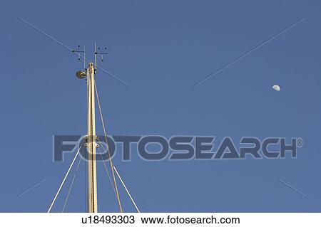 Stock Image - Blue, High Section, Half Moon, Day, Anemometer. Fotosearch