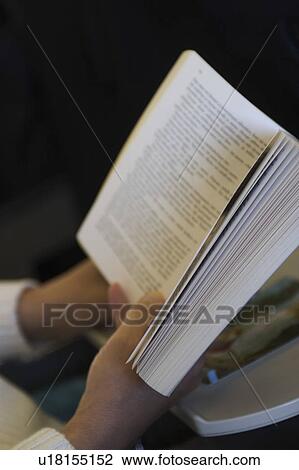 Stock Image - Book, Close-Up, Focus On Foreground, Holding, Indoors. Fotosearch