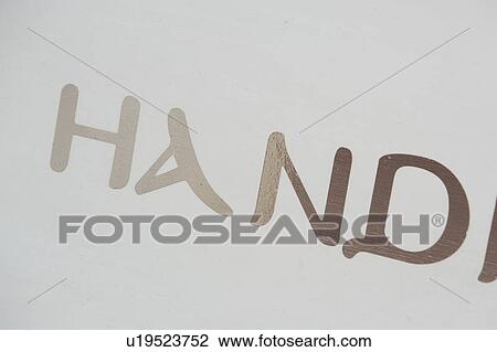 Stock Image - Brown, Hand, Close-Up, Capital Letter, Alphabet. Fotosearch