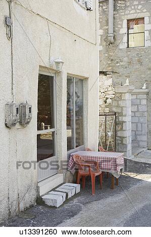 Stock Image - Building Exterior, Building Structure, Chair, Checked, Day. Fotosearch