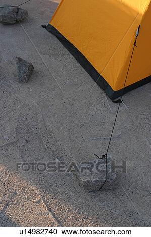 Stock Image - camping, tent, canvas, rope, taut, rocks. Fotosearch