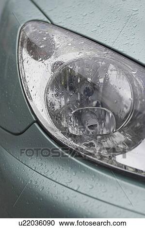 Stock Image - car, vehicle, headlights, automobile, raindrops, drops. Fotosearch