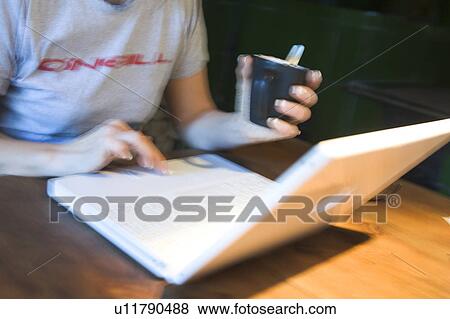 Stock Photo - Casual Clothing, Cup, Defocused. Fotosearch