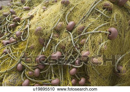 Stock Image - Close-Up, Day, Fishing Equipment, Fishing Net, Focus On Foreground. Fotosearch