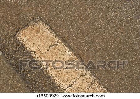 Stock Photo - Close-Up, Dividing Line, Day, Cracked, Asphalt. Fotosearch
