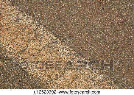 Stock Image - Close-Up, Grainy, Day, Asphalt. Fotosearch