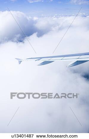 Clouded, Atmosphere, Climate, Bright, Blue Sky, Aircraft View Large Photo Image Stock Photo - Clouded, Atmosphere, Climate, Bright, Blue Sky, Aircraft. Fotosearch