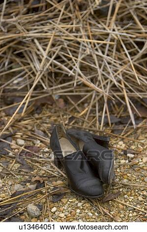 Stock Image - footgear, footwear, straw, fiber, strands, rural. Fotosearch