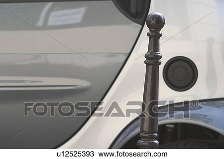 Stock Image - fuel cover, fuel lid, gas tank, vehicle, car, pole. Fotosearch