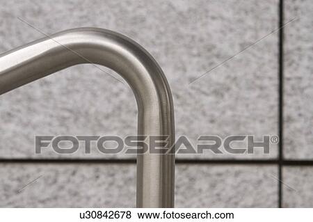 Stock Photo - handle, wall, focus, close-up, bent, shine. Fotosearch