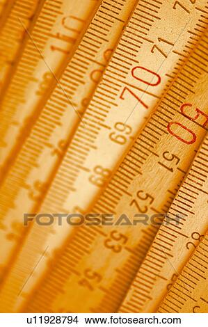 Picture - measures, inch, dimension, meter, metric, measurement. Fotosearch